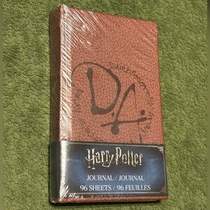 Dumbledores Army journal from Wizarding World Loot Crate box, 5 1/2”h by 3 1/3”w